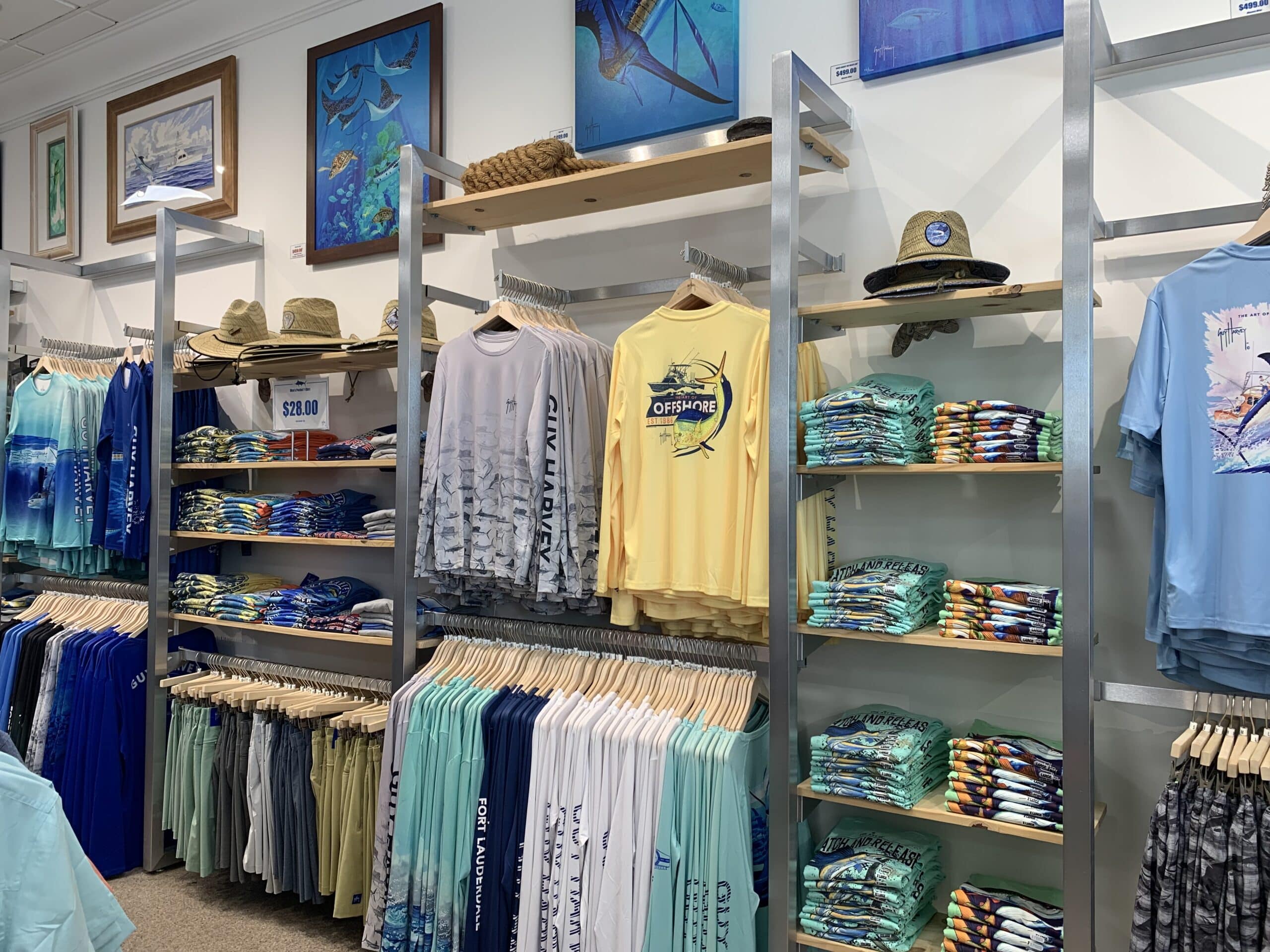chrome wall rack with wood shelves in guy harvey store