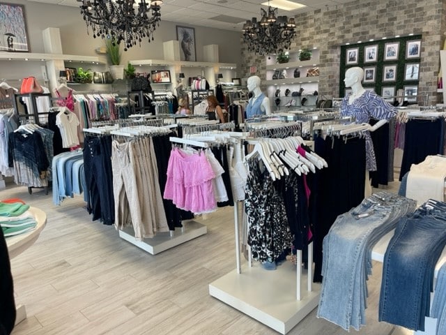 boutique clothing store with garment racks and floor displays for clothing