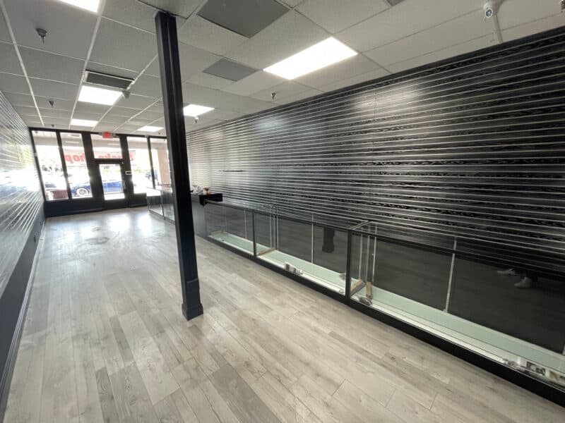 Black woodgrain slatwall panels in a retail store