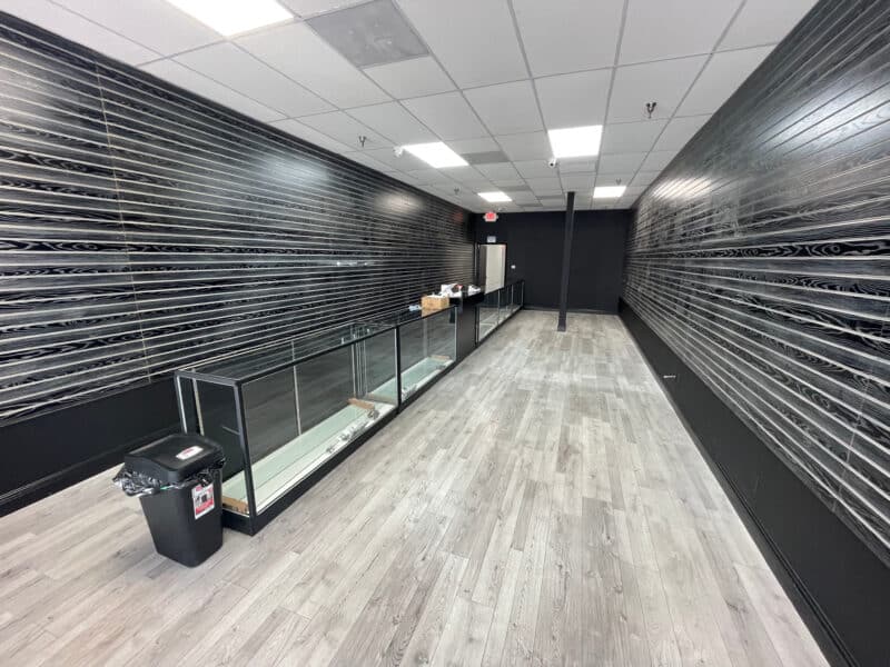 Black Woodgrain Slatwall Panels with Aluminum INserts in a Smoke Shop