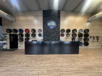 Sonoma Oak Slatwall Panels 3 Inch Grooves with Metal Inserts Sonoma Oak Slatwall Panels in Tire Shop